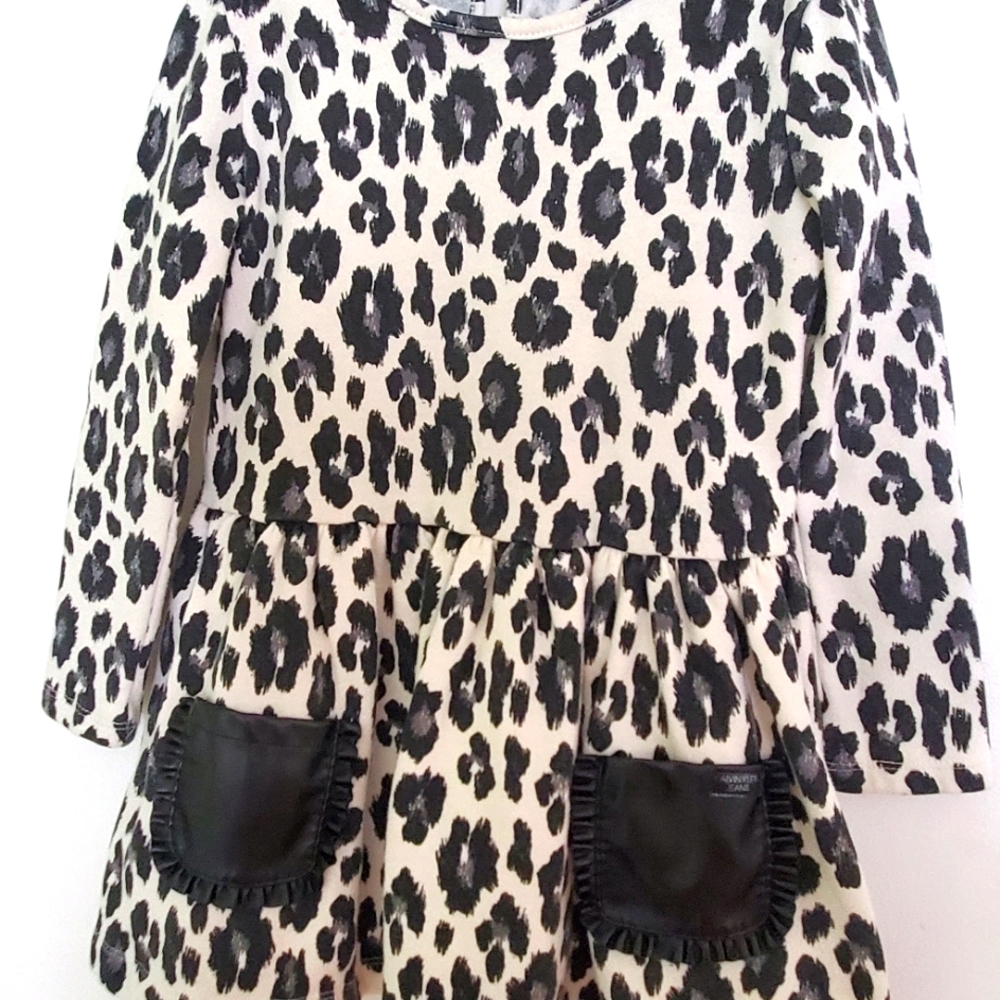 Dress with black leather pockets